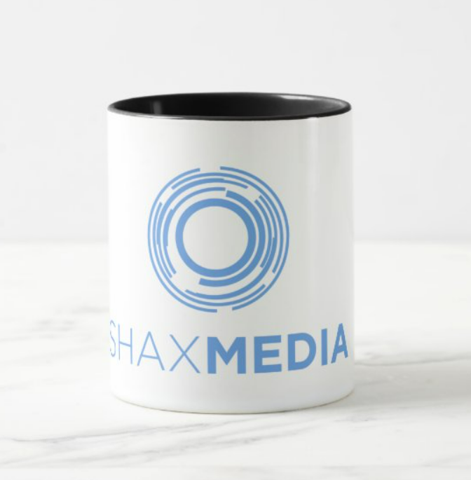 A white mug with the word shaxmedia on it
