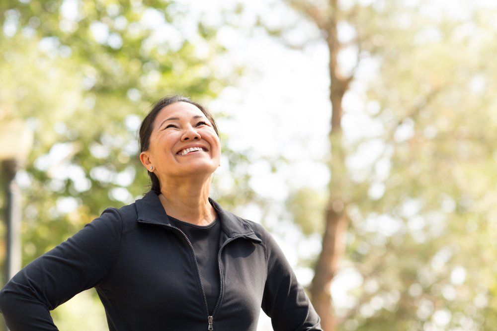 Woman Happy After Exercise — Colonic Healthcare in Rosslea, QLD