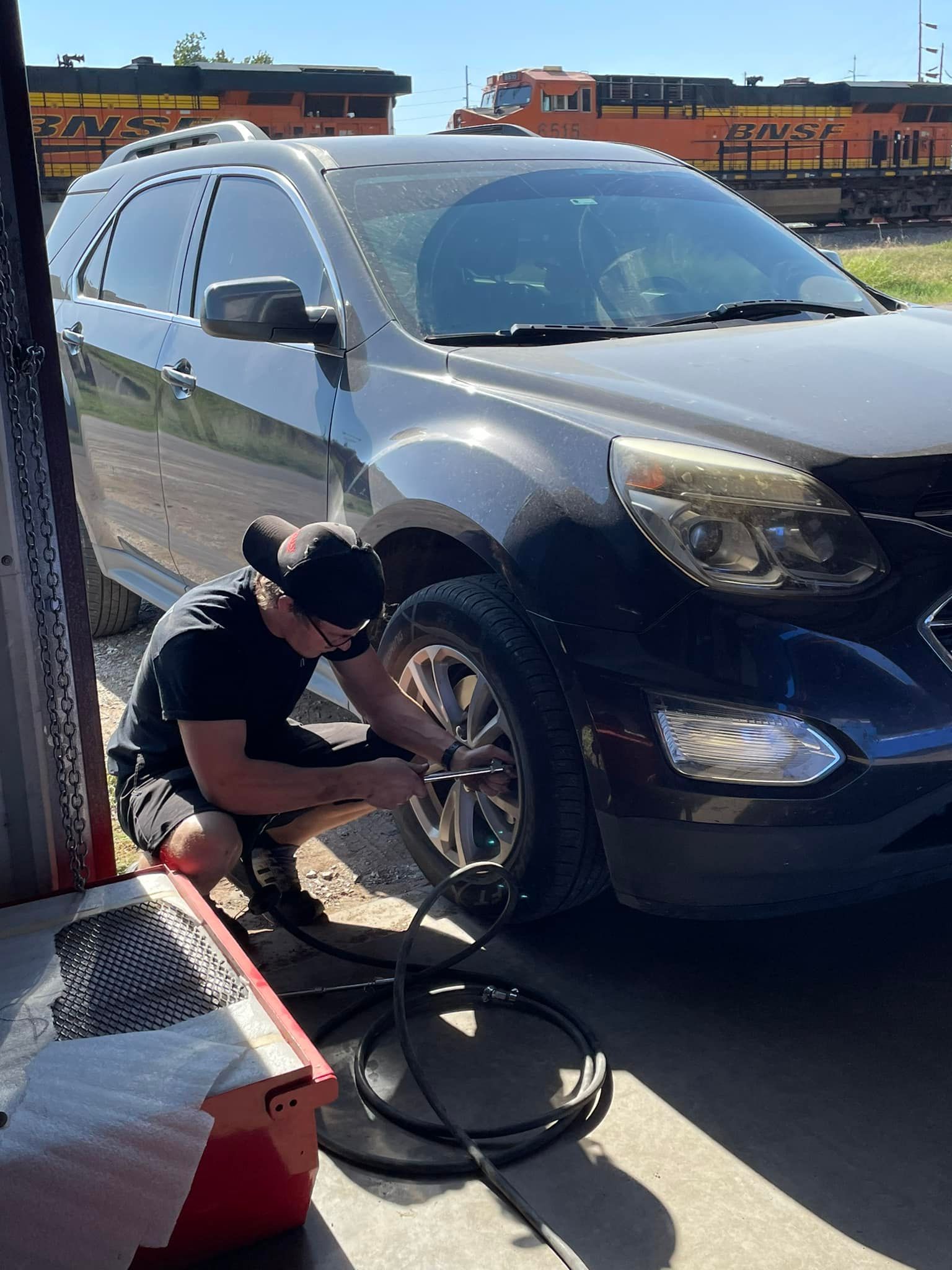 Mechanic Repairing a Car Tire | Pauls Valley Automotive