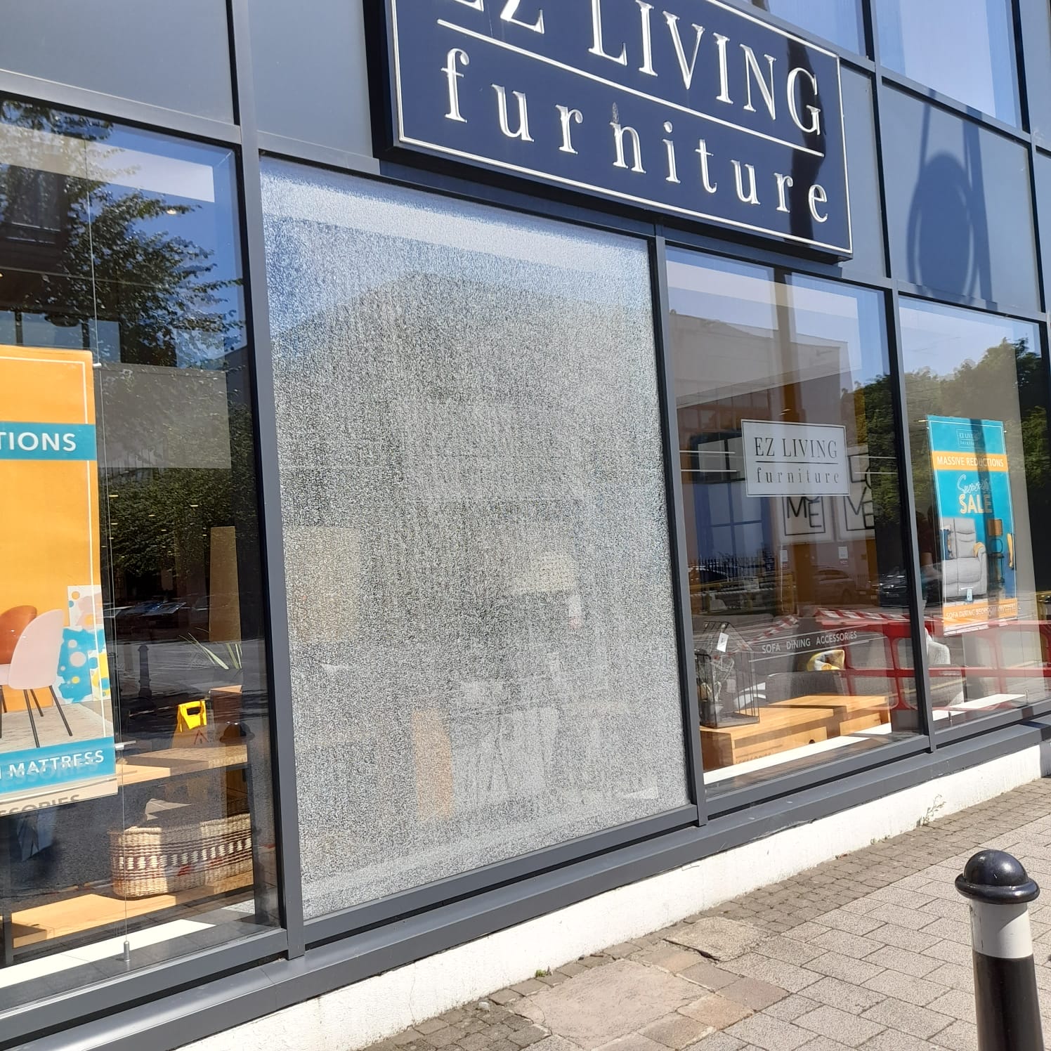 A living furniture store with a large window