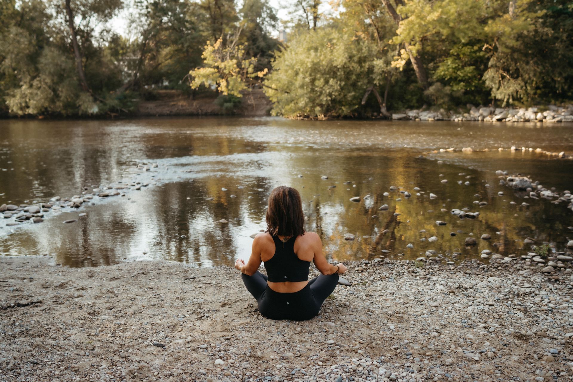 Nicole Kelley sits by the river, calm and focused, reflecting on discipline, structure, and freedom