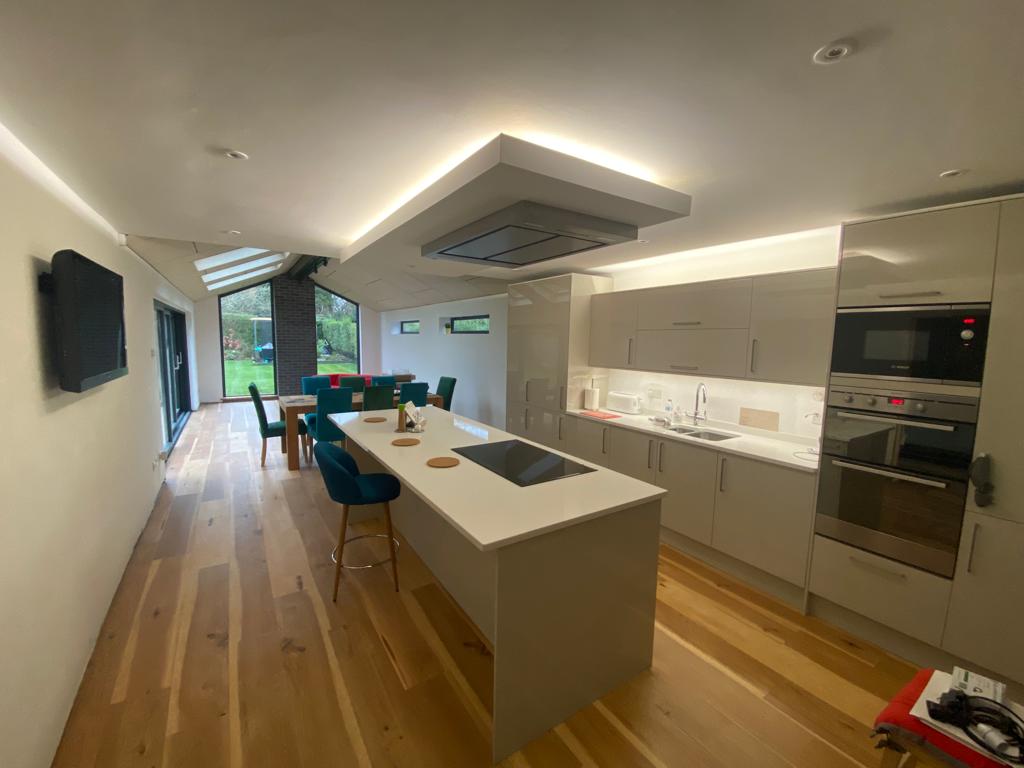 There is a large island in the middle of the kitchen.