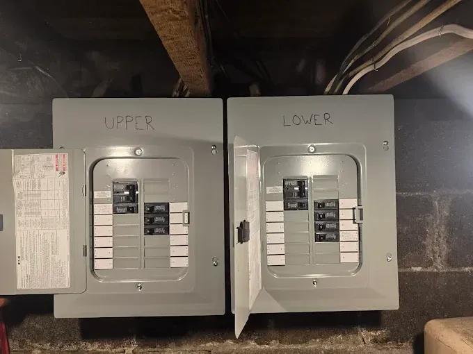 Two gray electrical panels labeled 