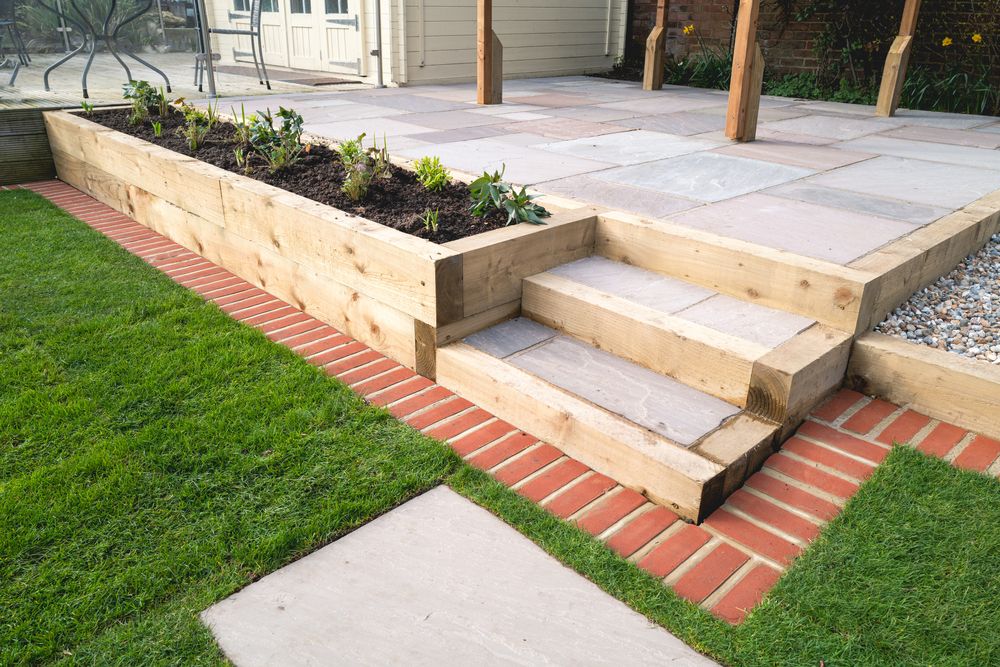 Raised Wooden Garden Bed With Brick — NQ Prefab Concrete Products Pty Ltd in Mission Beach, QLD