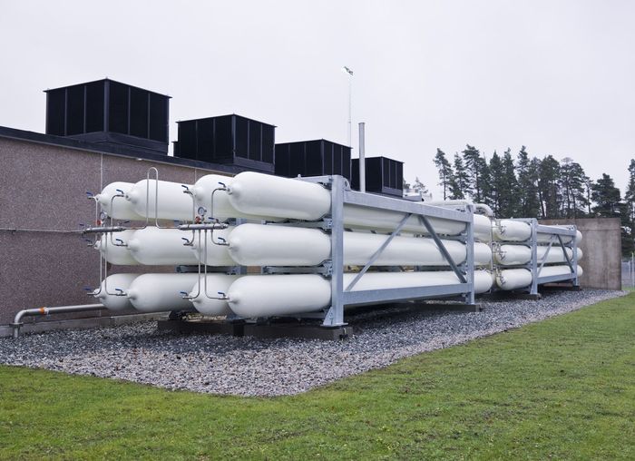 A bunch of white pipes are stacked on top of each other