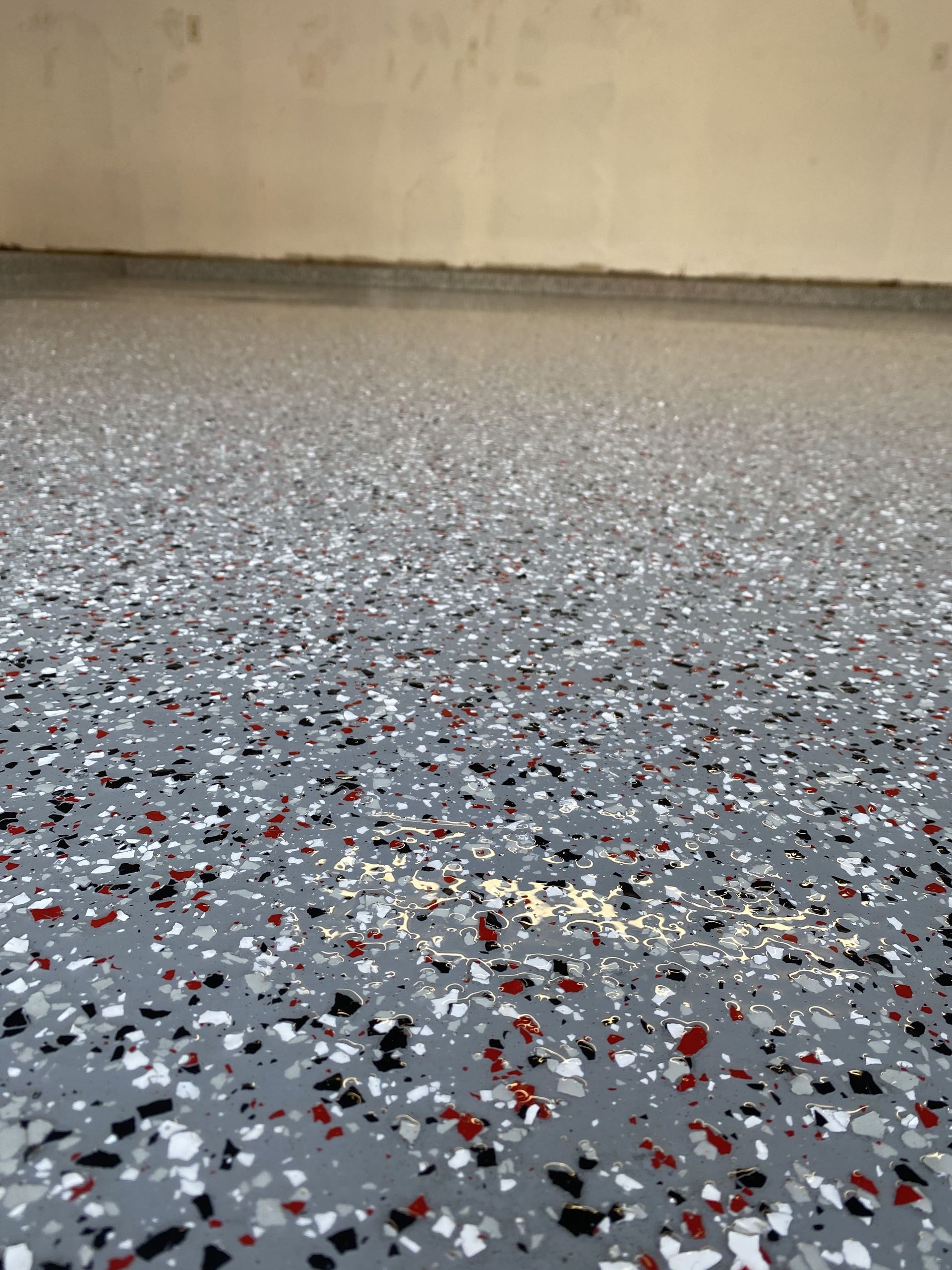 Gray speckled epoxy garage floor.