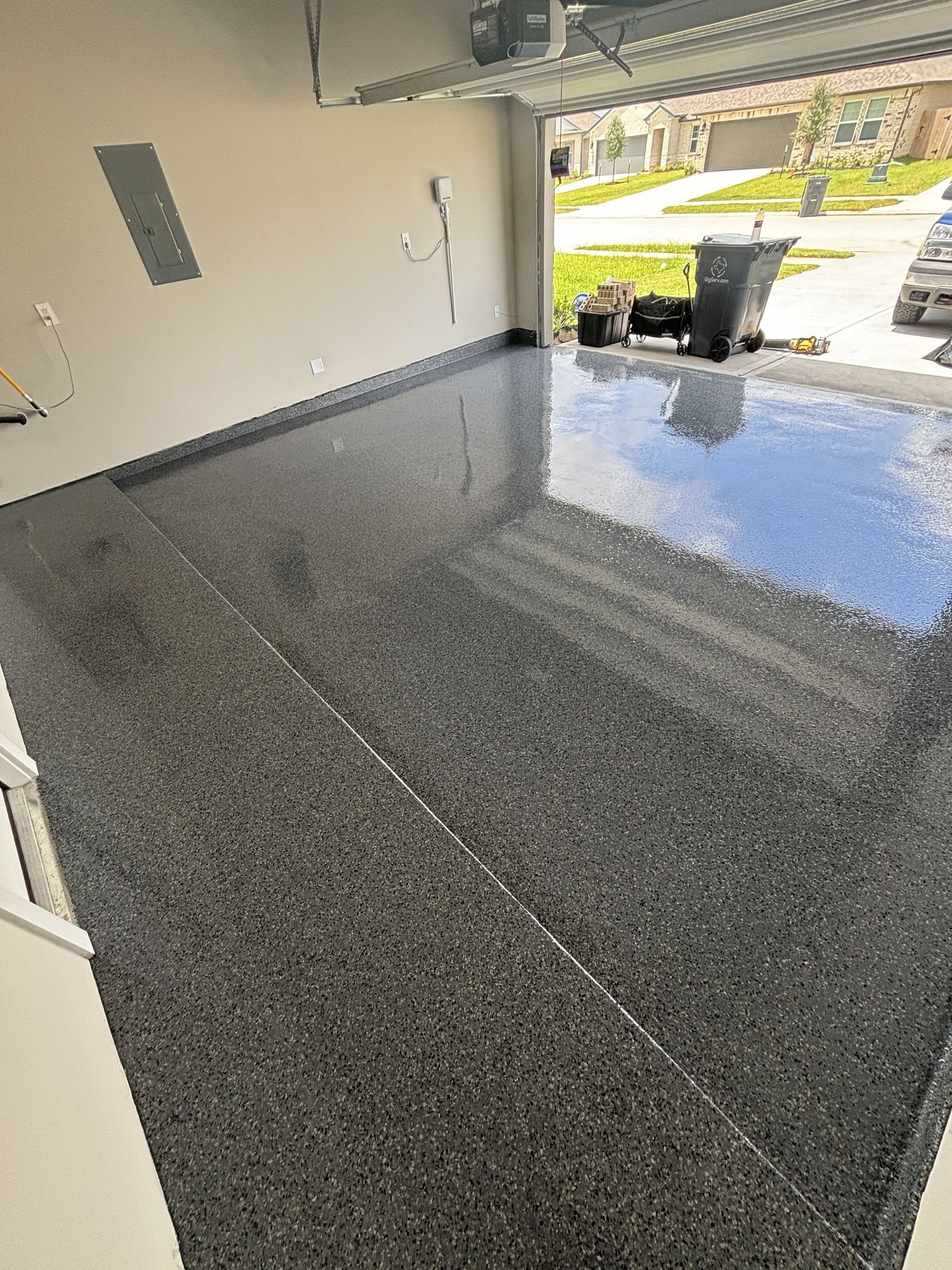 Black epoxy floor with embedded glitter and red