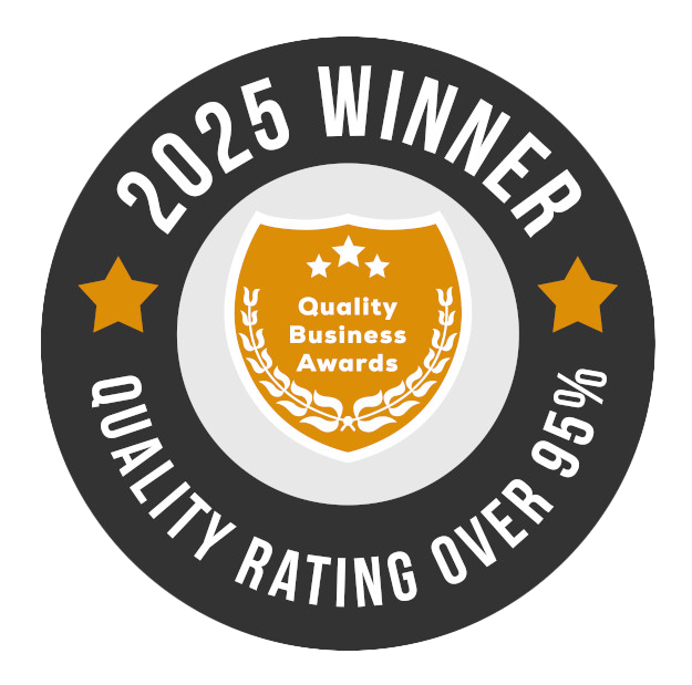 2025 Winner seal. Dark gray circle with gold accents, 
