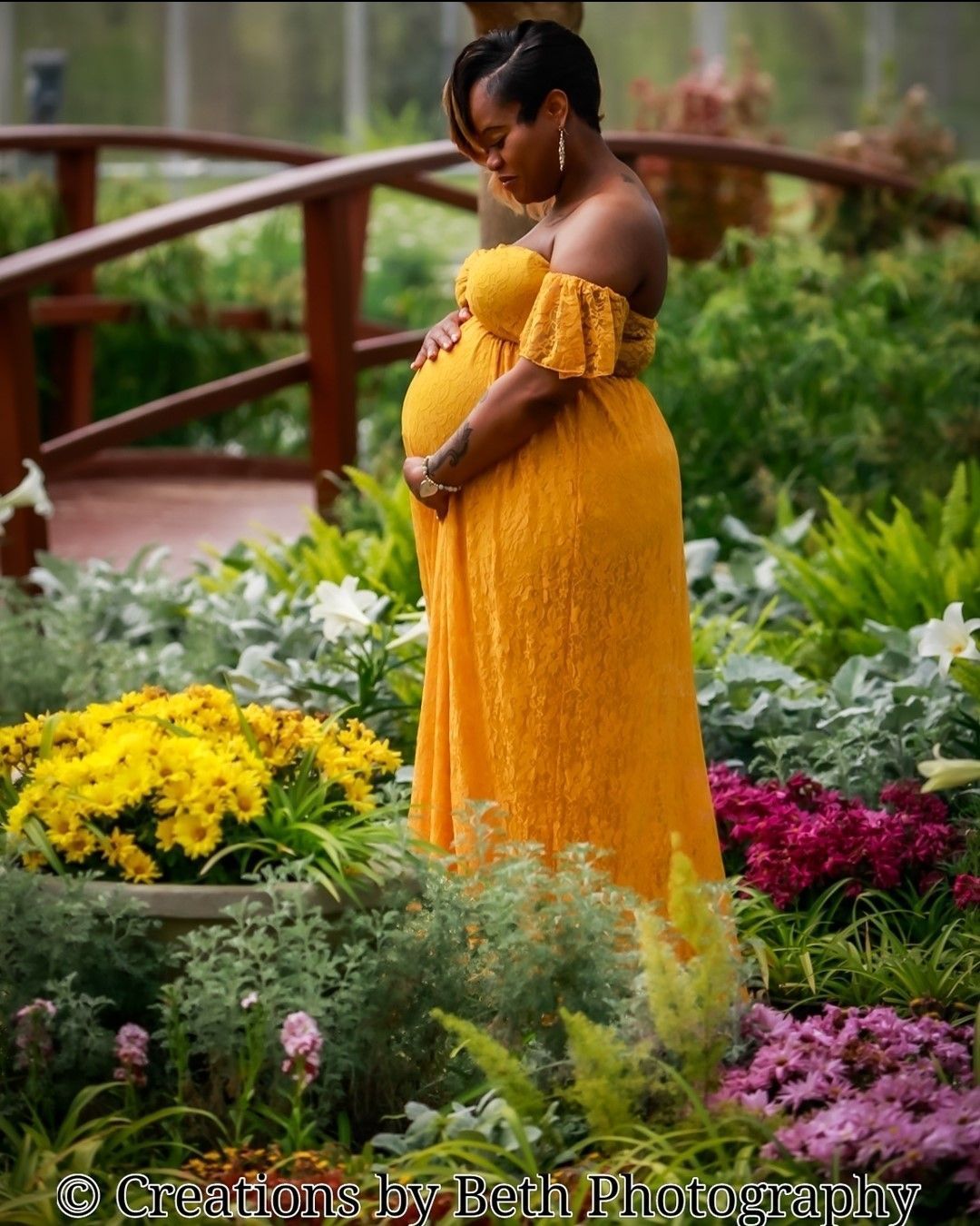 maternity session with flowers and greenery