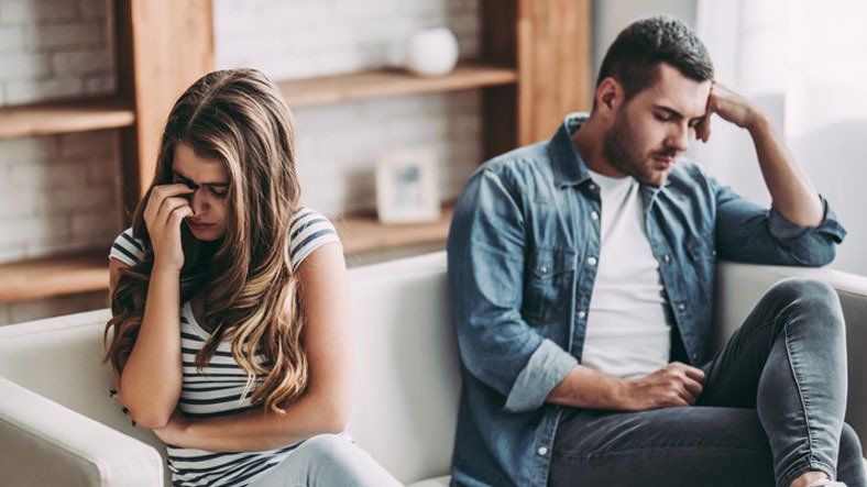 Upset couple at home