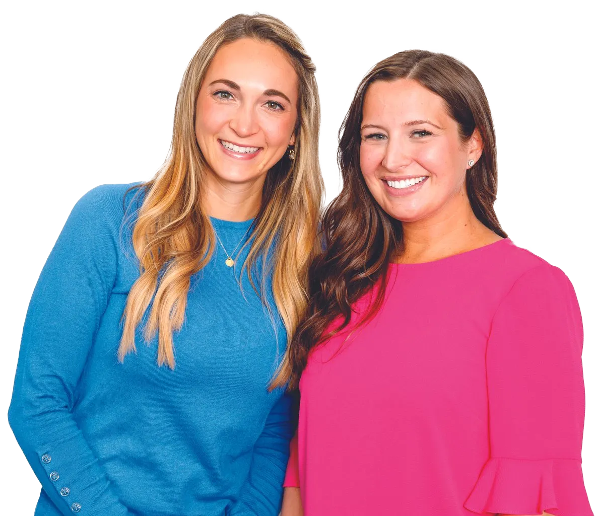 Two women are posing for a picture and one is wearing a blue sweater and the other is wearing a pink shirt.