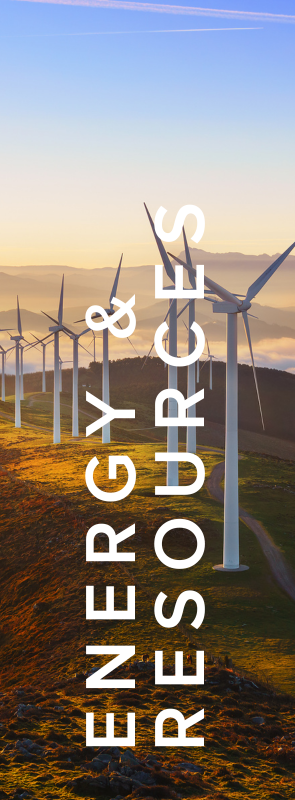 A group of wind turbines are sitting on top of a hill.