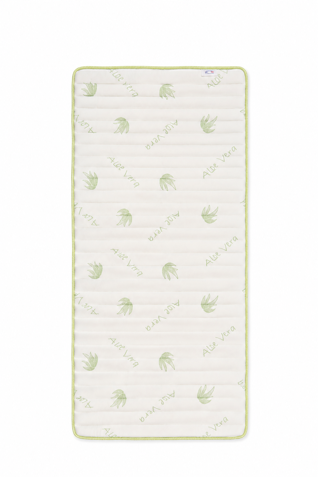Materasso rettangolare bianco con motivo a foglie verde chiaro e bordo cucito.