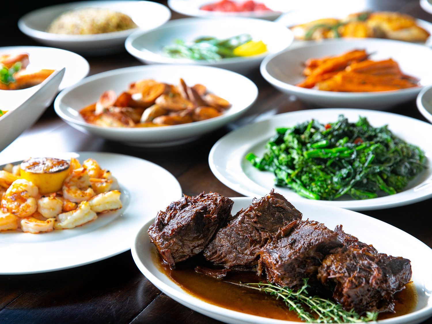 A table set with a spread of dishes to share