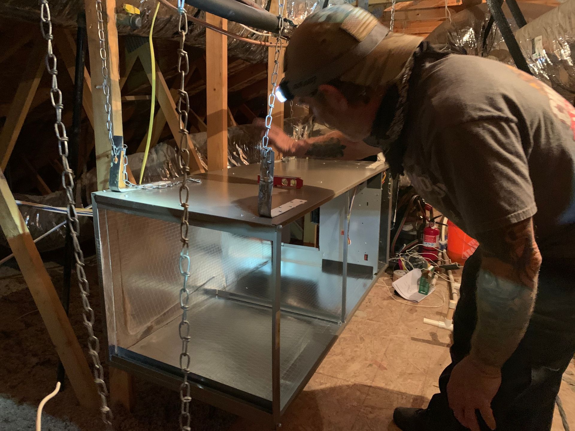 Man Checking A Metal Container — Buckeye, AZ — HOMEFRONT AIR CONDITIONING LLC