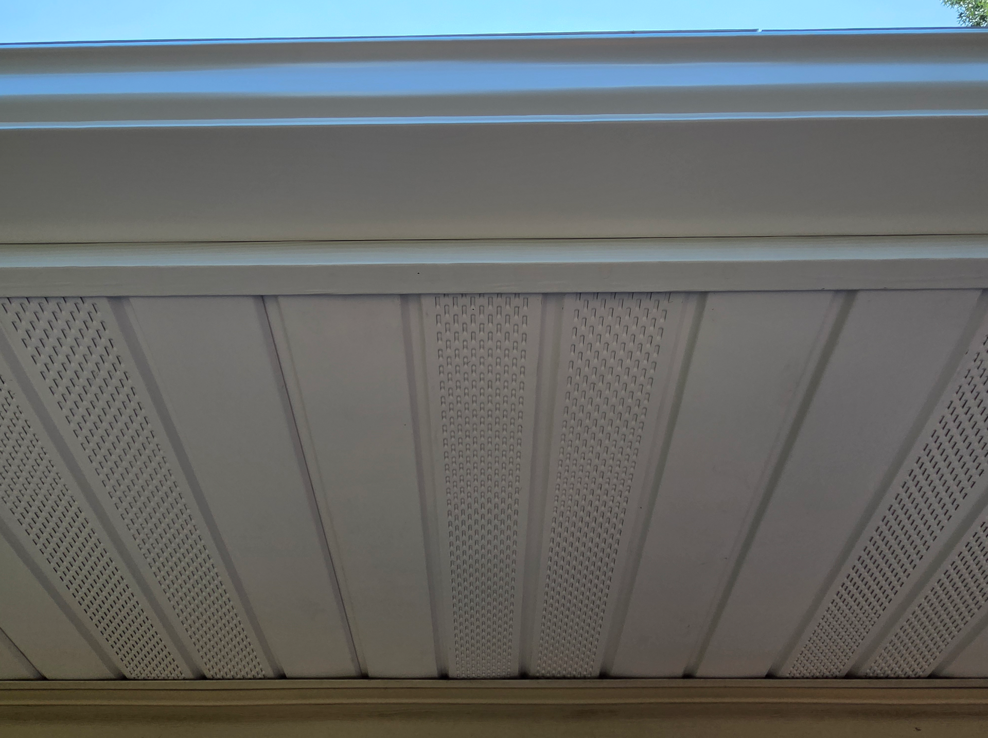 A large house with a brown roof and white siding | Siding contractor in springfield mo