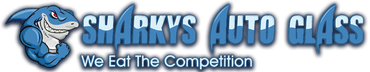 Blue Shurky’s Auto Glass logo with shark mascot and tagline “We Eat The Competition”