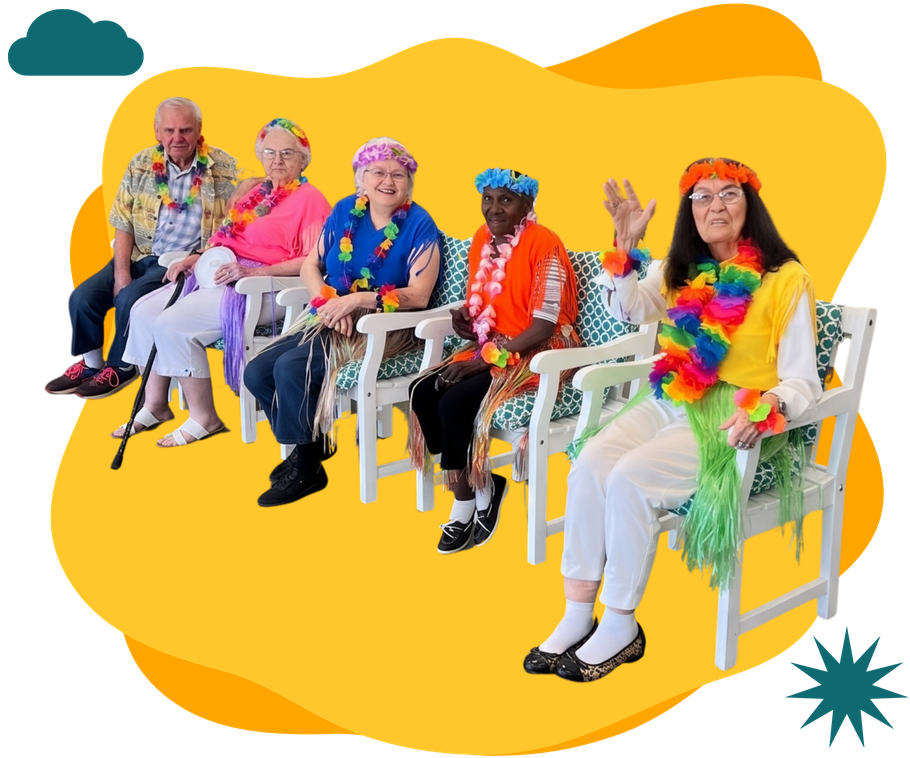 Six colorful costumed people sitting on white chairs against a bright yellow backdrop