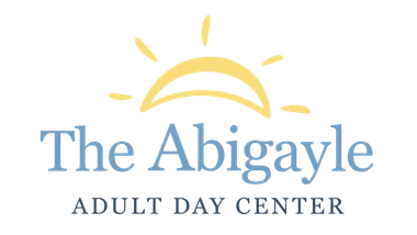 Logo for The Abigayle Adult Day Center with a yellow sun over blue text