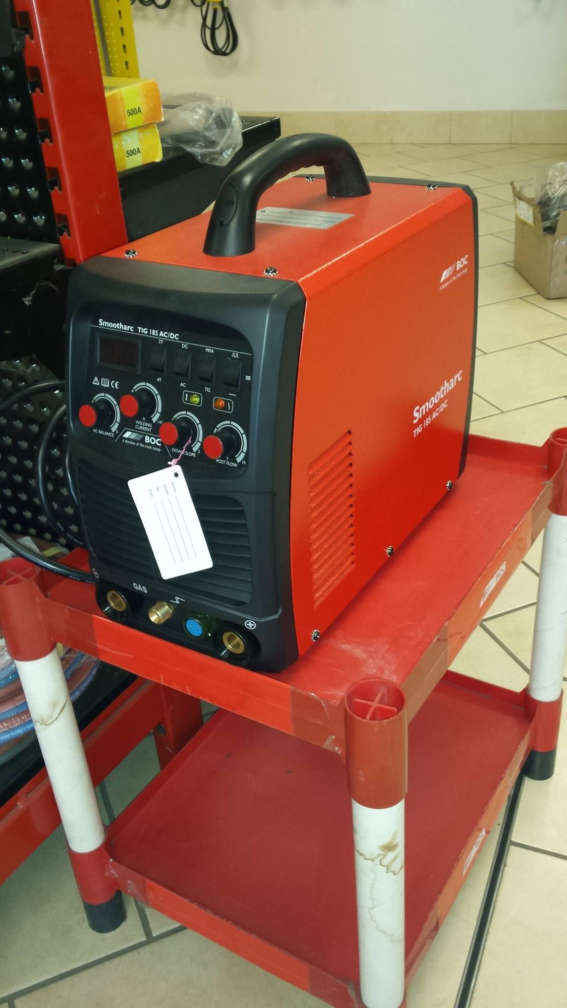 A Red Welding Machine With a Black Control Panel Sits on a Red Cart — Eastcoast Bearings & Hydraulics in South Grafton, NSW