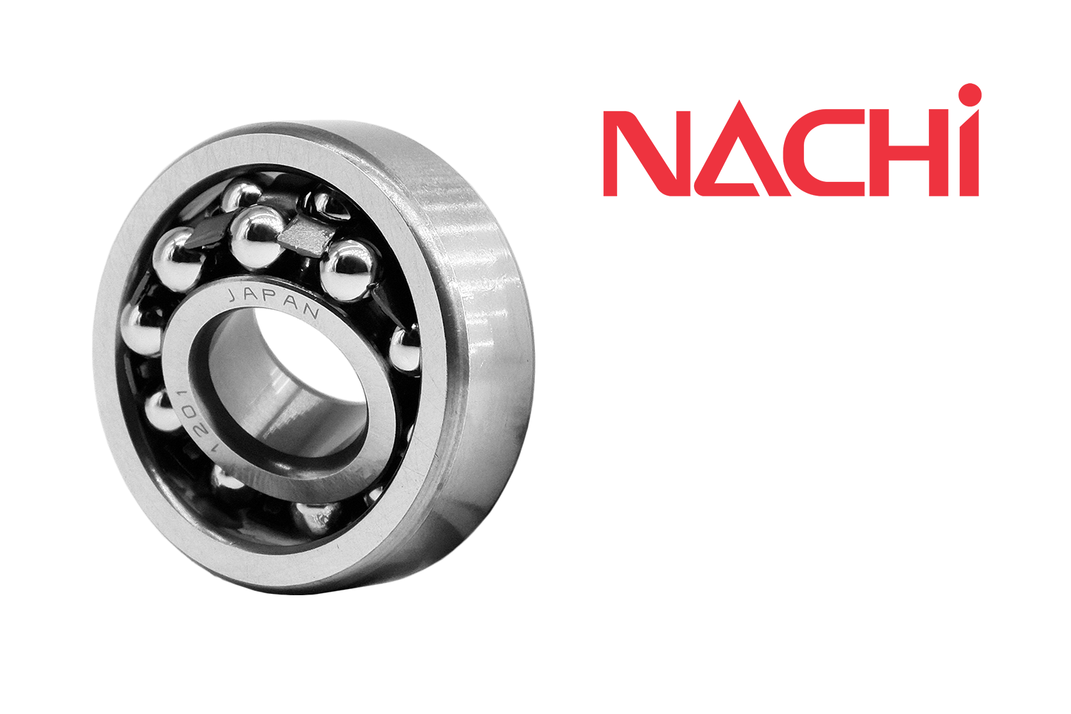 Two steel tapered roller bearing components resting on a dark asphalt surface.