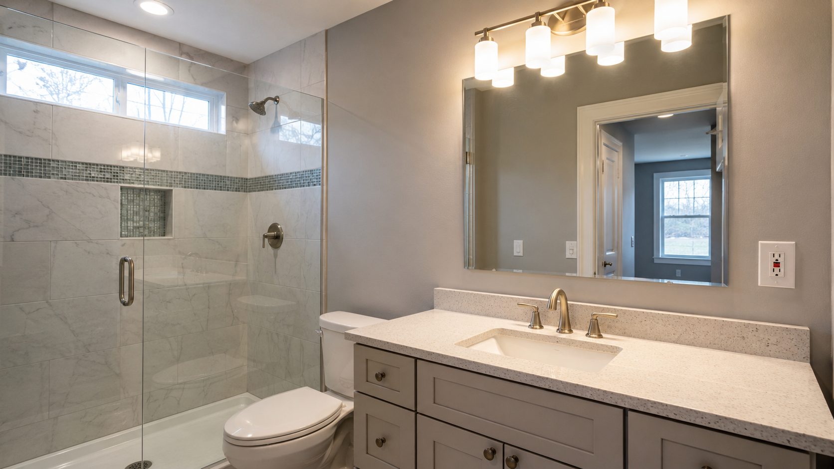 Bathroom vanity lighting and GFCI outlet installed during a remodel
