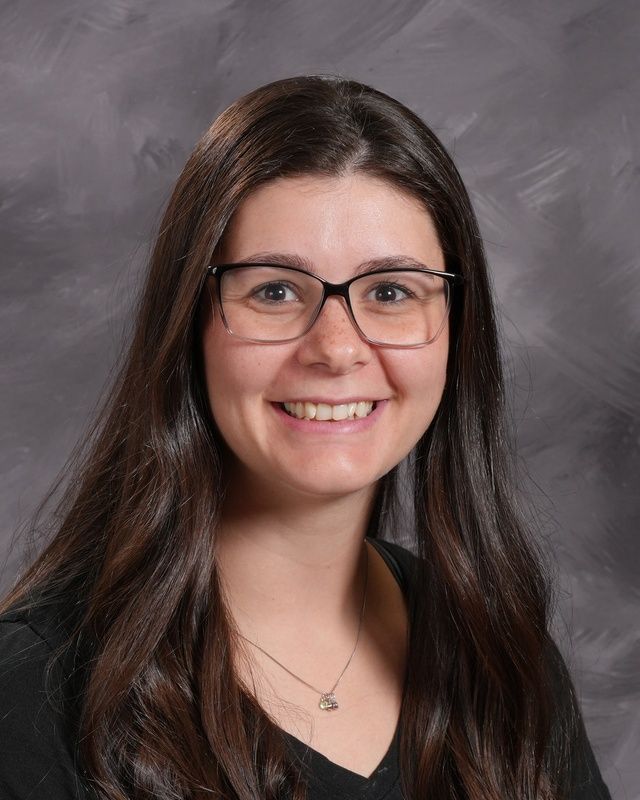 Woman wearing glasses smiling for the camera