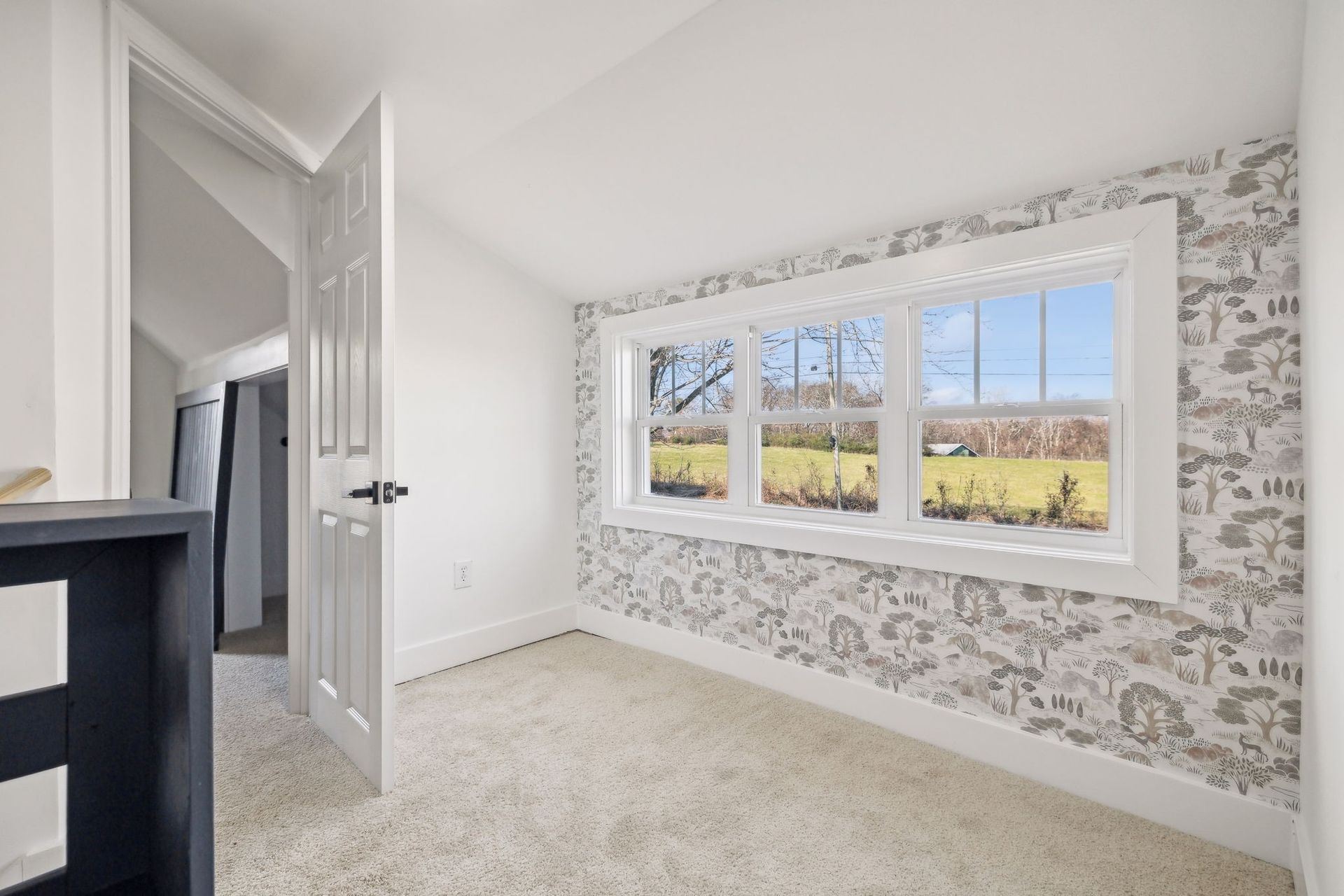 There is a large window in the middle of the room