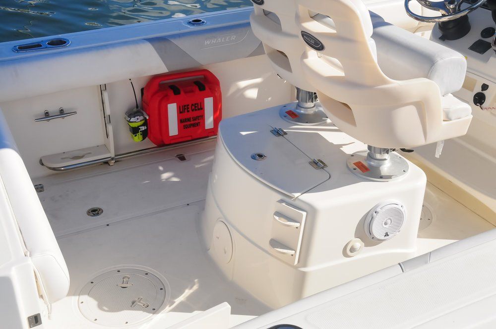 A boat with a seat and a first aid kit on it LIFECELL products