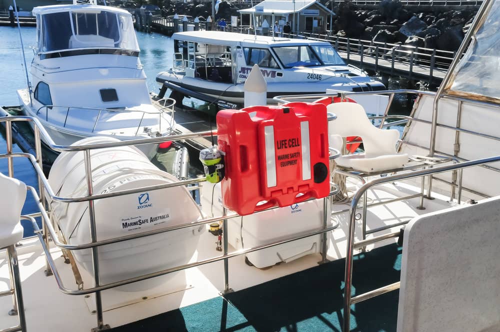 A boat with a red container attached to the side of it LIFECELL products