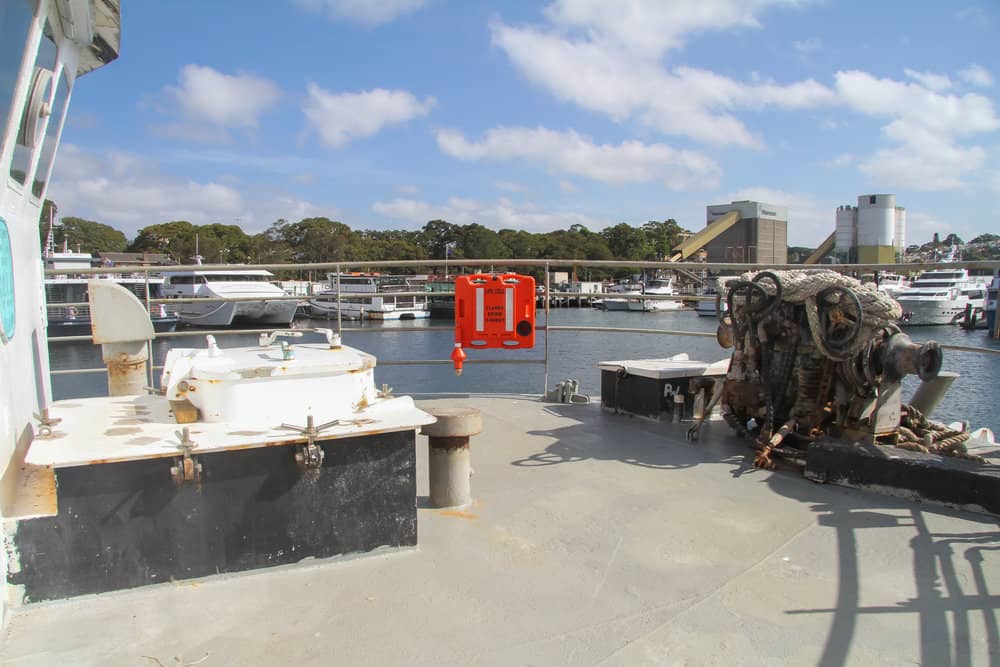 A boat is docked in a harbor with boats in the background. LIFECELL products