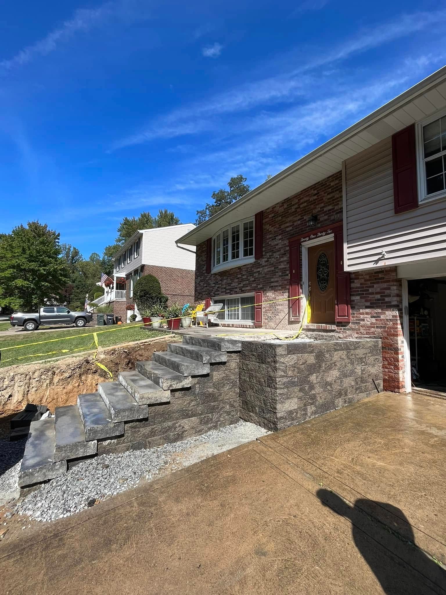 A house with stairs being built in front of it.
