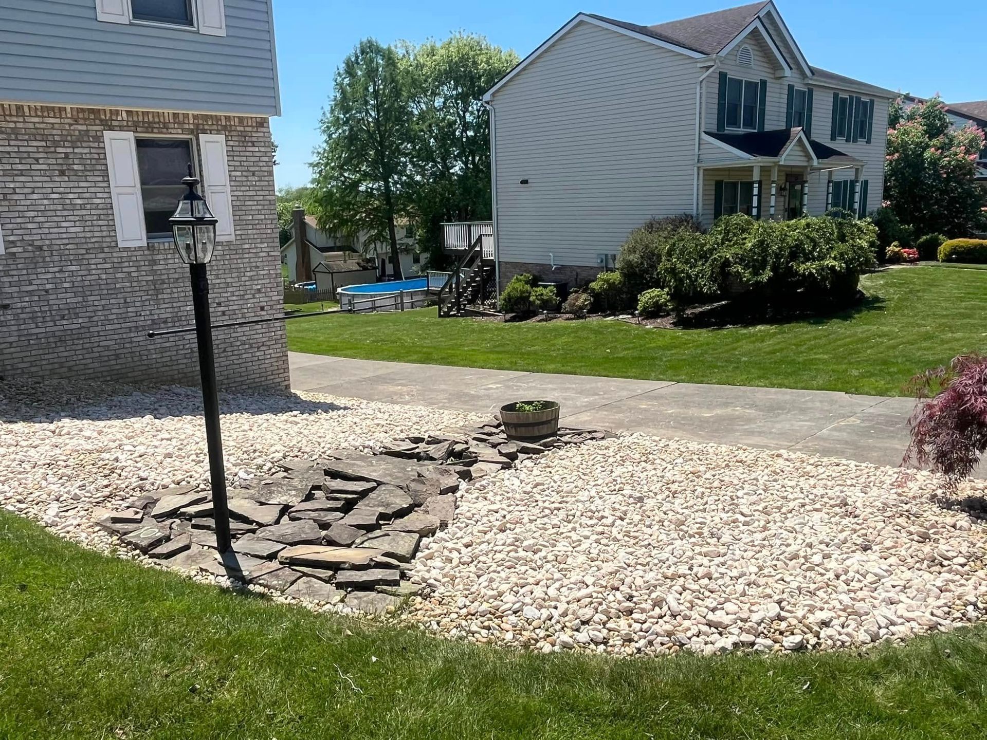 A house with a lot of gravel in front of it