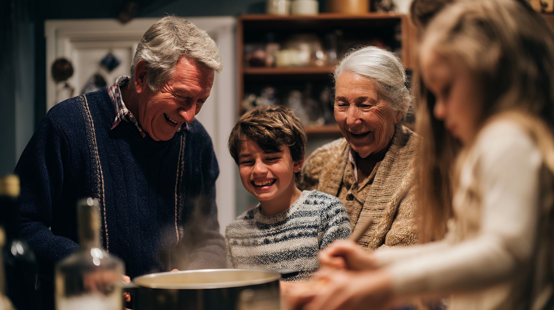 Family smiling together around a table in a warm kitchen, sharing a meal or dessert.