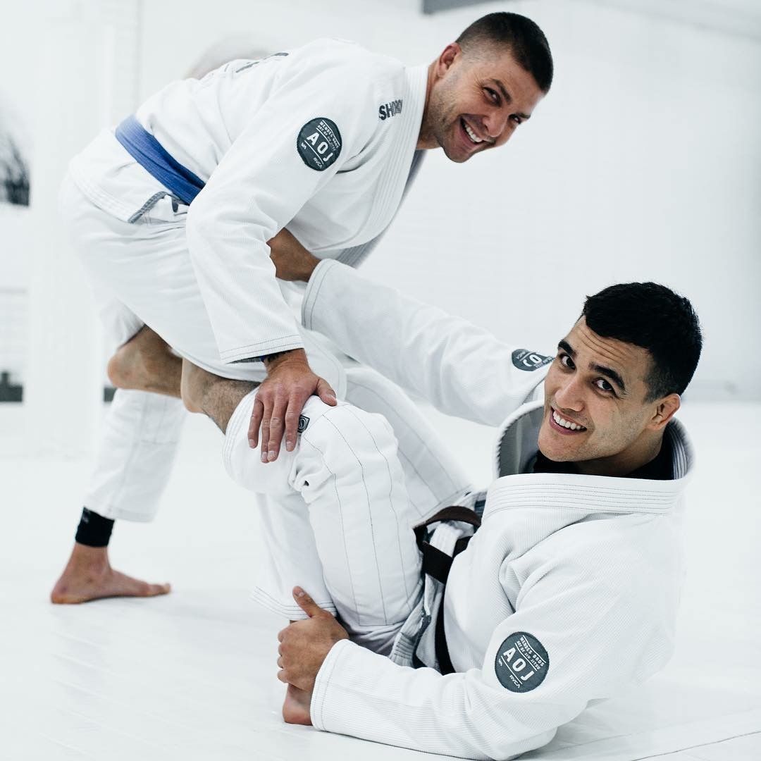 Adult students drilling Brazilian Jiu Jitsu techniques at Breathe Jiu Jitsu in Yaphank, NY.