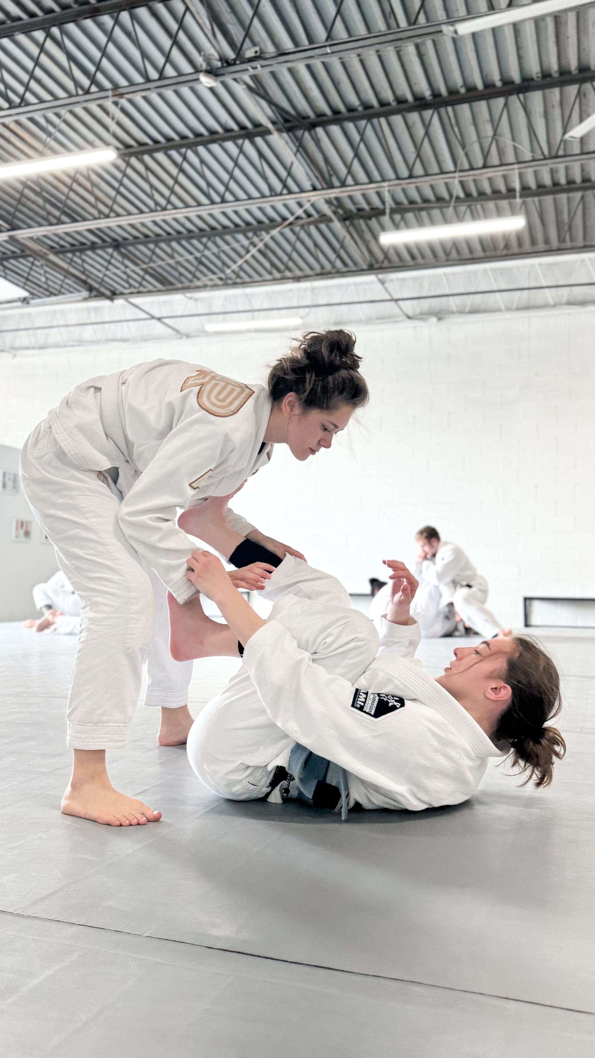 Adults training Brazilian Jiu Jitsu at Breathe Jiu Jitsu in Yaphank, NY, building fitness.