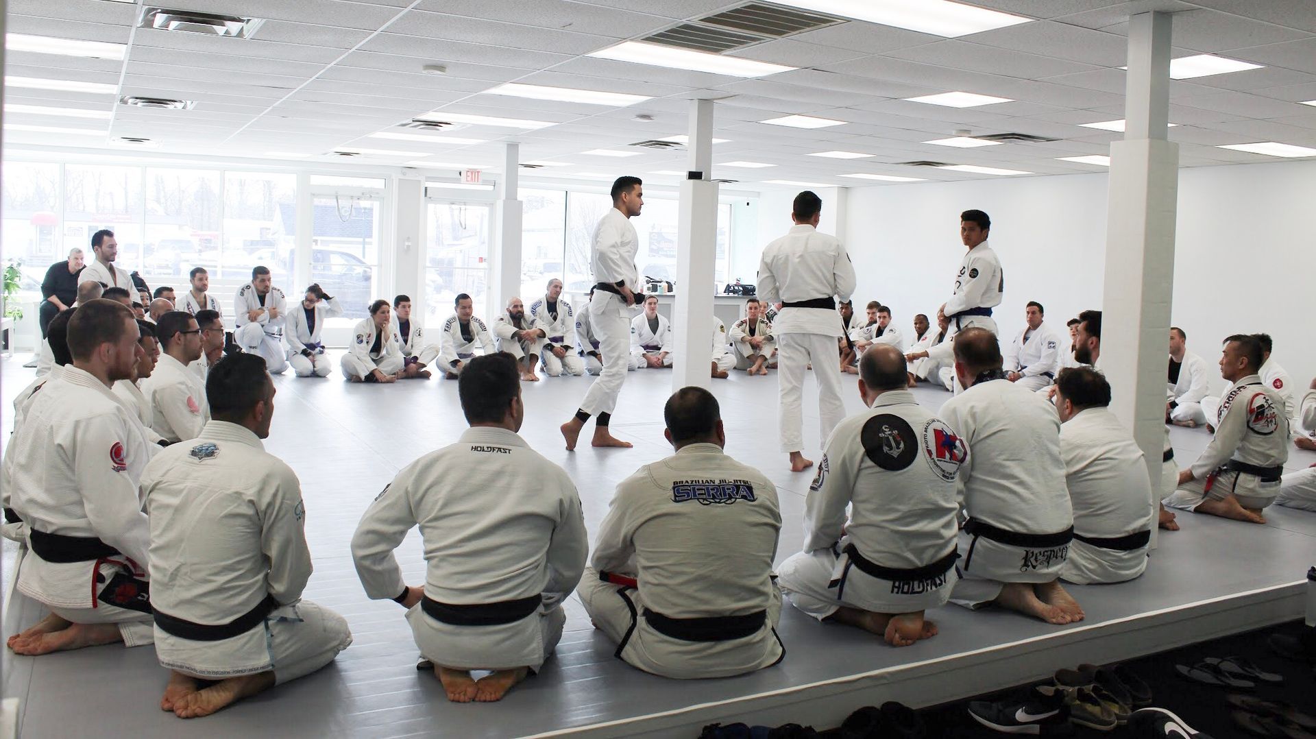 Adults drilling Brazilian Jiu Jitsu techniques at Breathe Jiu Jitsu in Yaphank, NY to build fitness 