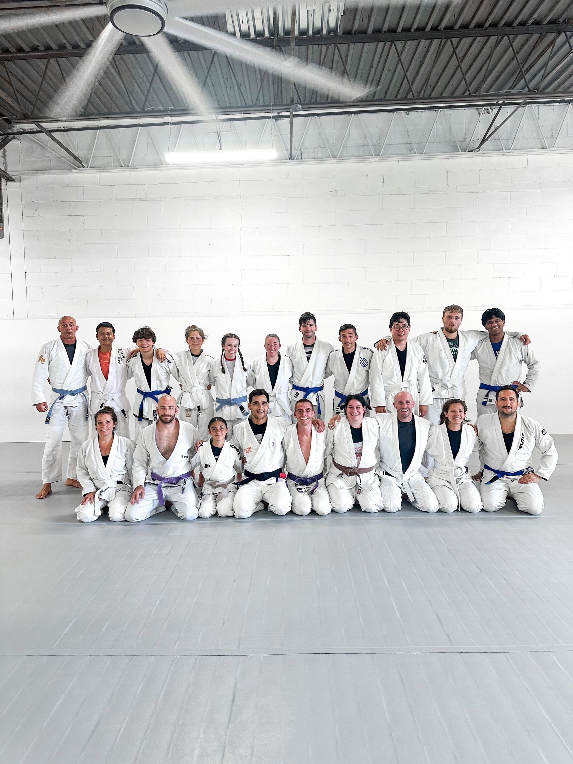 Adults drilling Brazilian Jiu Jitsu technique at Breathe Jiu Jitsu in Yaphank, NY, building strength and confidence.