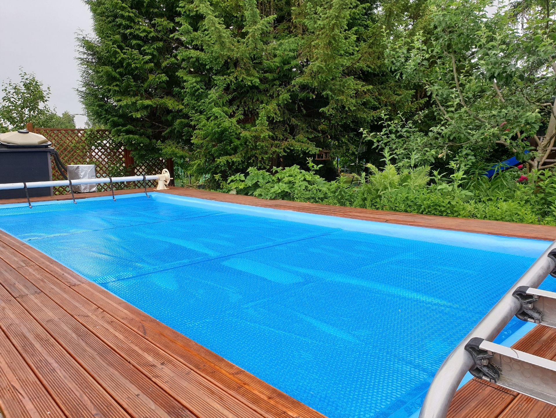 Pool cover installed for winter protection, part of expert pool maintenance services in Spring House