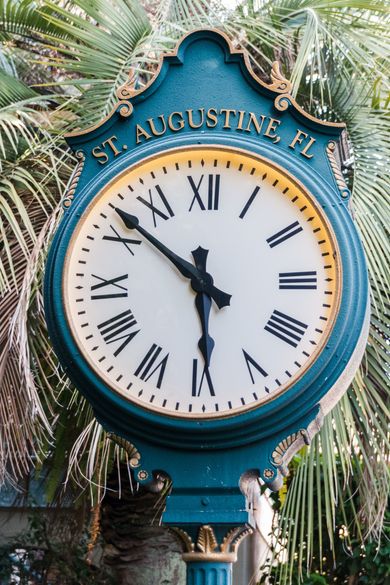A clock that says st. augustine fl on it