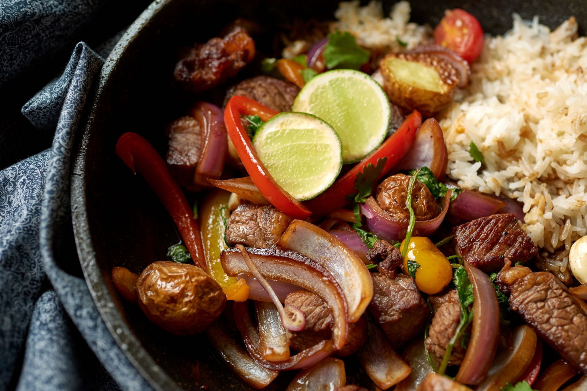 A close up of a bowl of food with rice and vegetables.