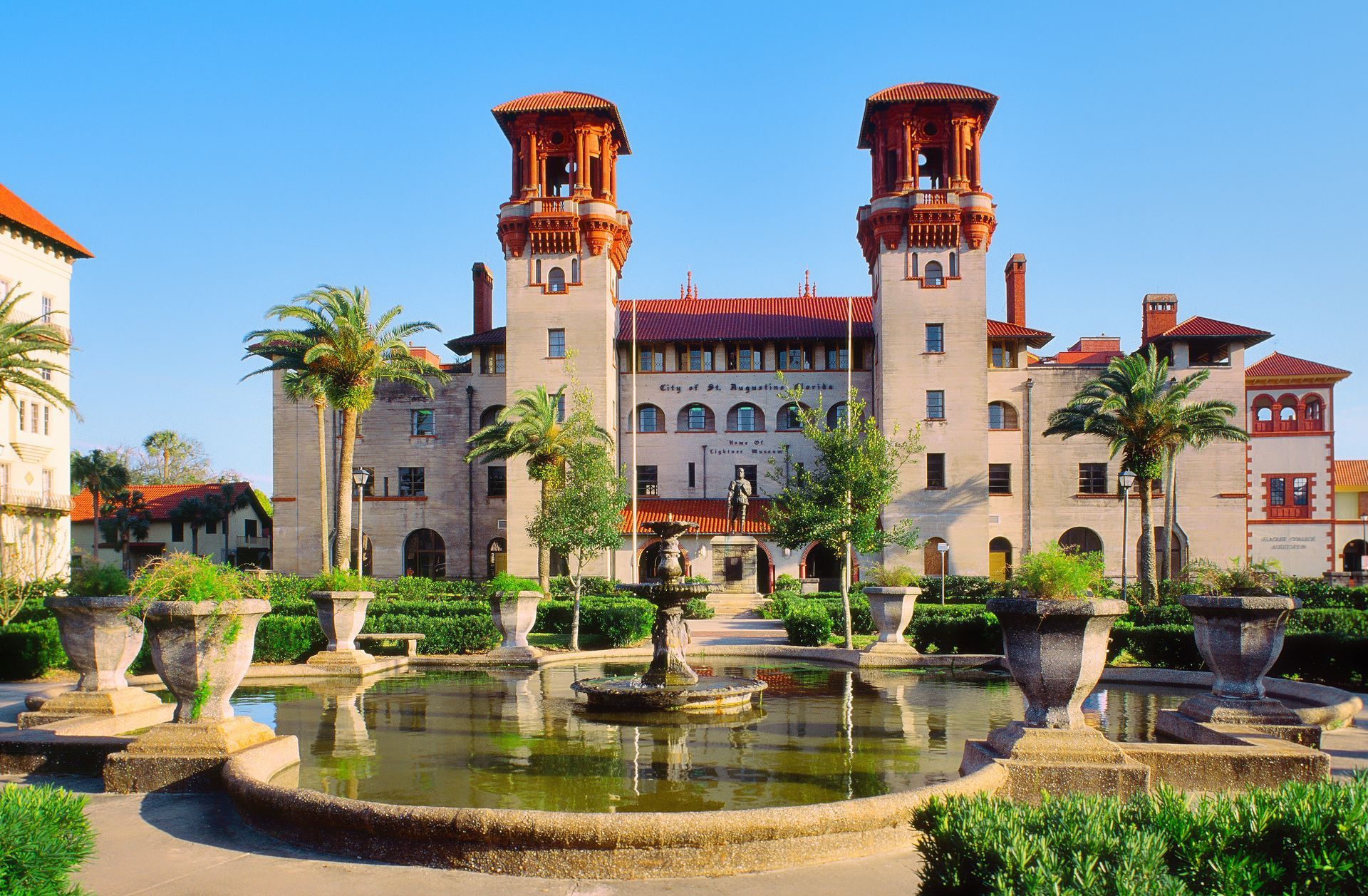 A large building with a fountain in front of it.