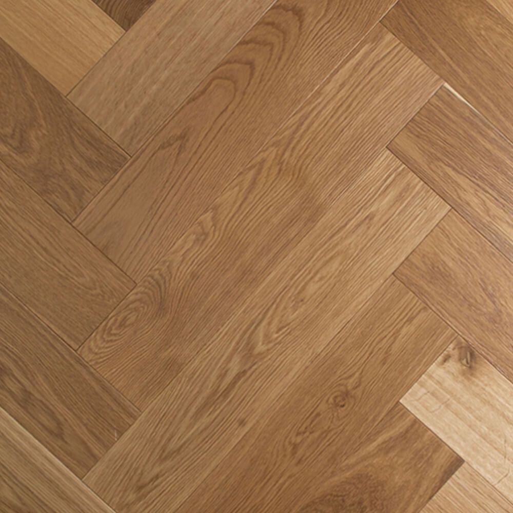Herringbone pattern wood flooring. Brown, natural wood grain.