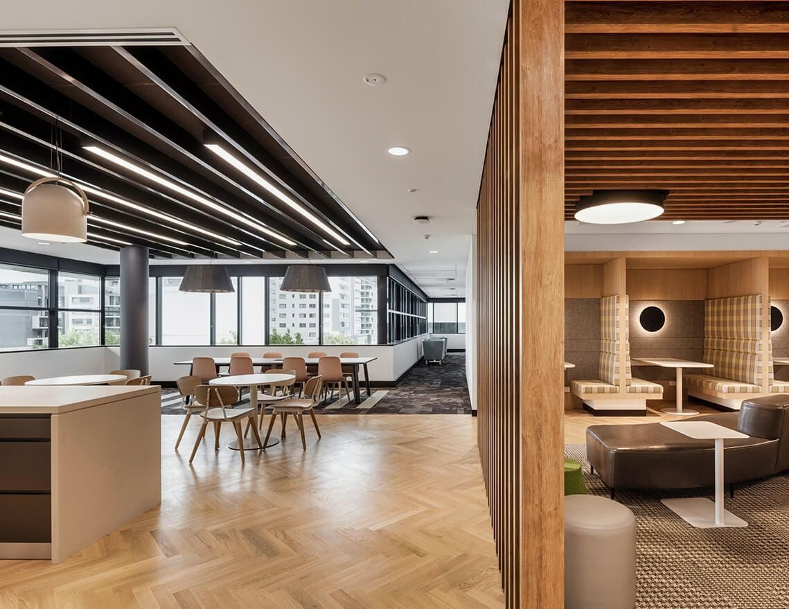 A Large Room with Tables and Chairs in It — Tony Di Milia Flooring in Unanderra, NSW