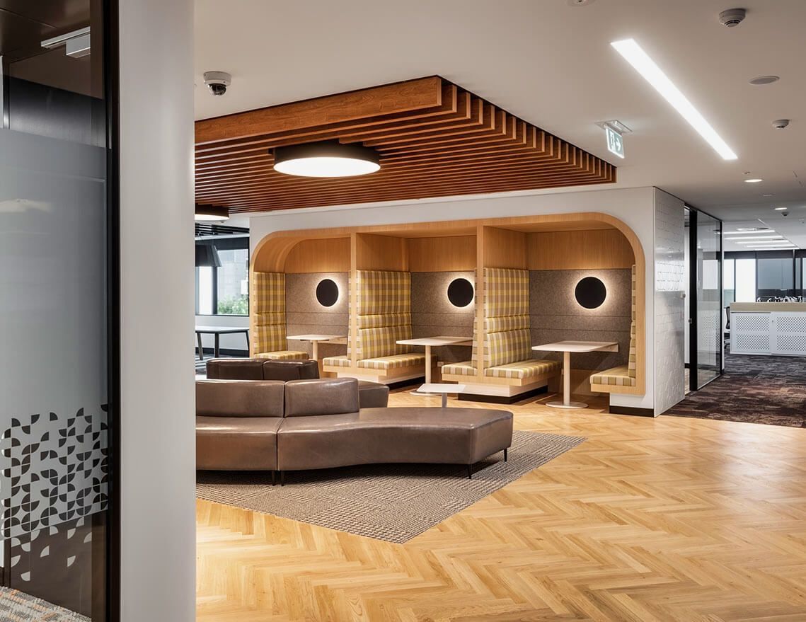 A Living Room with A Couch and Tables in It — Tony Di Milia Flooring in Unanderra, NSW