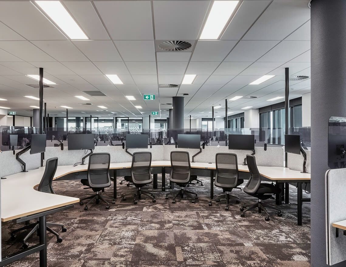 A Large Office with A Lot of Desks and Chairs — Tony Di Milia Flooring in Unanderra, NSW