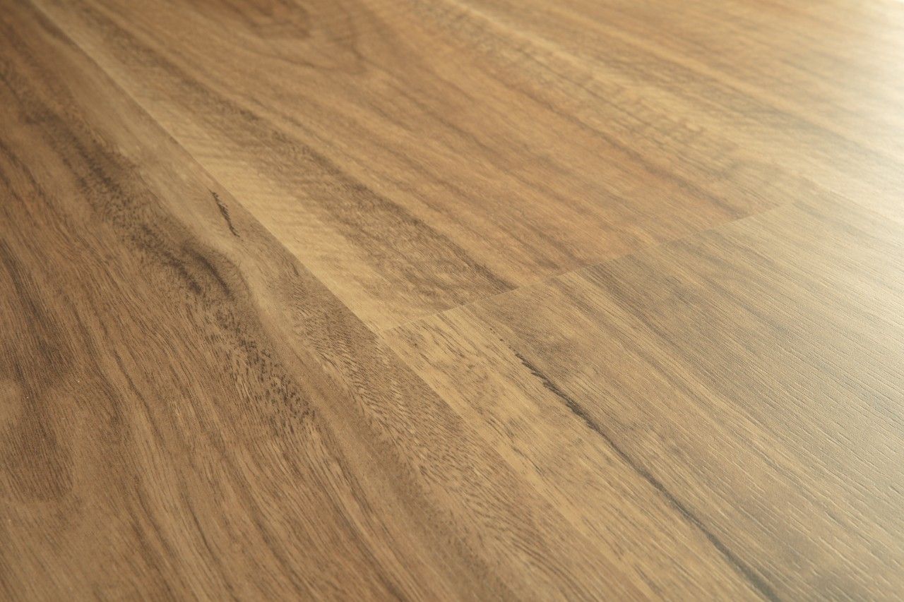 Natural timber grain surface with warm brown tones and visible texture, resembling a timber table.