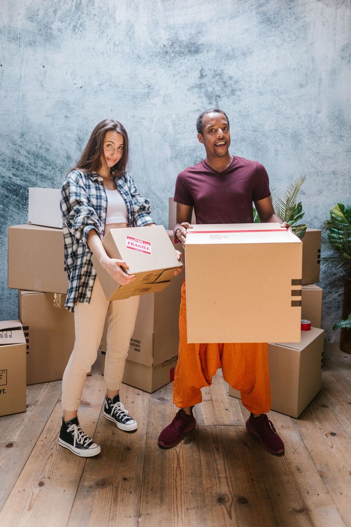 Happy homeowners preparing for a smooth relocation with dependable moving services from Renton Movers Pros, WA.