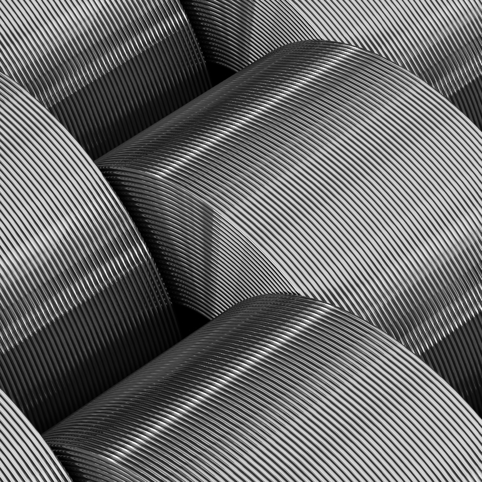 Close-up of curved metallic surfaces with repeating lines, creating an abstract industrial texture.