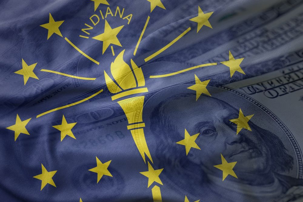 Indiana state flag overlaid on U.S. dollar bills and a close-up of George Washington on currency